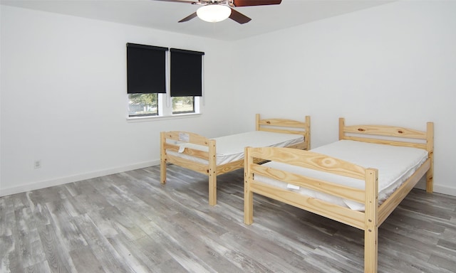 1022 Kintner Dr, Graham, TX 76450 - bedroom featuring light wood-style flooring, baseboards, and ceiling fan