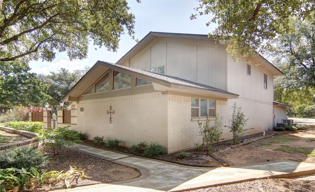 1022 Kintner Dr, Graham, TX 76450 - view of side of property with brick siding, central AC unit, and fence