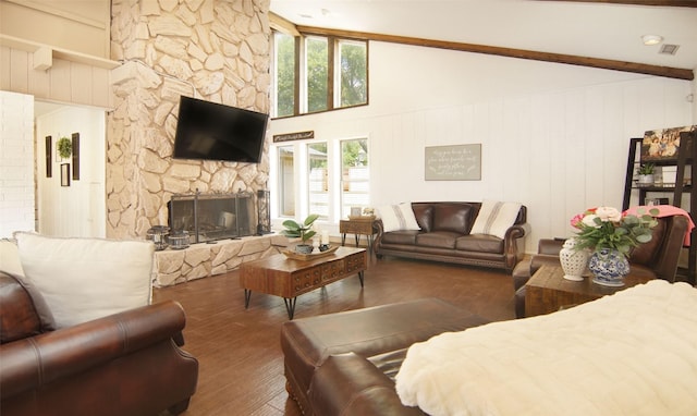 1022 Kintner Dr, Graham, TX 76450 - living room featuring plenty of natural light, a fireplace, wood finished floors, beamed ceiling, and a towering ceiling