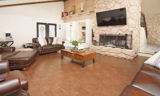 1022 Kintner Dr, Graham, TX 76450 - living area featuring a fireplace, a high ceiling, wood finished floors, and french doors