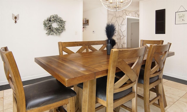 1022 Kintner Dr, Graham, TX 76450 - dining room featuring a chandelier, baseboards, and light tile patterned floors