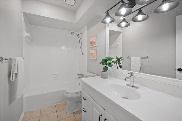 bathroom with tile patterned floors, toilet, vanity, and shower / washtub combination