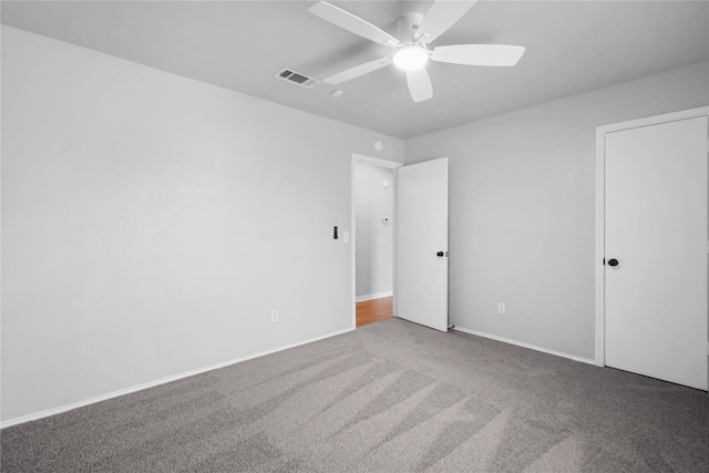 unfurnished bedroom with carpet and a ceiling fan