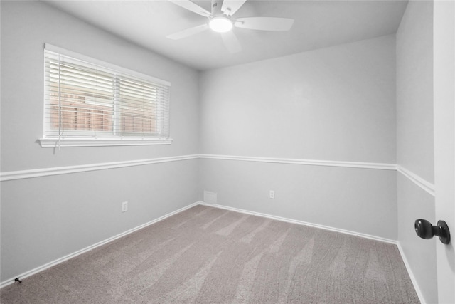 unfurnished room featuring ceiling fan, carpet floors, and baseboards
