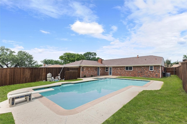 view of pool with central AC unit, a patio area, and a diving board