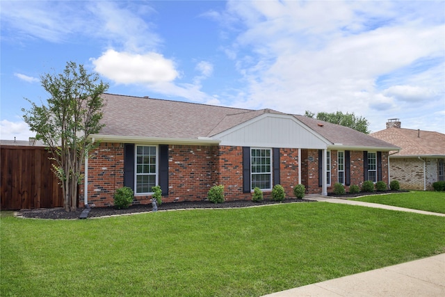 ranch-style house with brick siding and roof with shingles