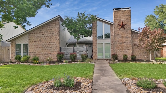 1503 Hindsdale Dr, Richardson, TX 75081 - view of front facade featuring brick siding and a chimney