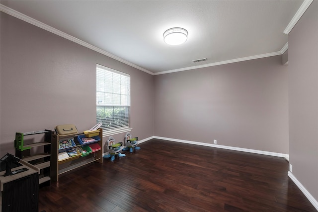 game room featuring ornamental molding, wood finished floors, and baseboards