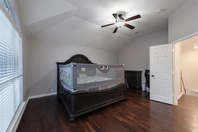 bedroom featuring lofted ceiling, wood finished floors, a ceiling fan, and baseboards
