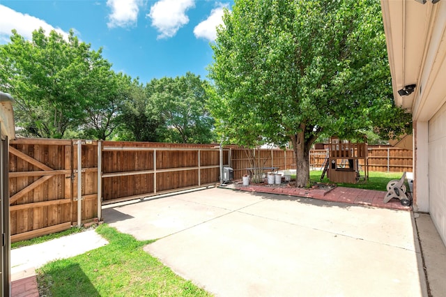 view of patio featuring a fenced backyard and a gate