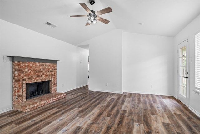 5320 Waterford Dr, Mesquite, TX 75150 - unfurnished living room featuring vaulted ceiling, wood finished floors, a brick fireplace, and ceiling fan