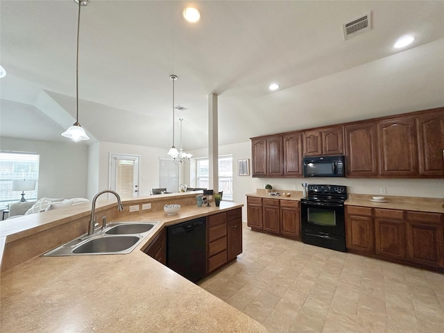 2041 Matador Ranch Rd, Fort Worth, TX 76134 - kitchen featuring black appliances, a sink, light countertops, decorative light fixtures, and recessed lighting