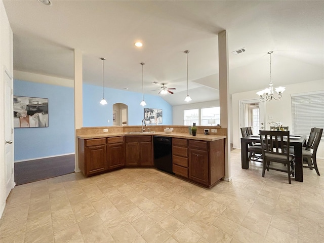 2041 Matador Ranch Rd, Fort Worth, TX 76134 - kitchen with black dishwasher, a sink, light countertops, vaulted ceiling, and pendant lighting