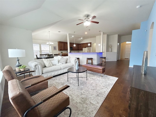 2041 Matador Ranch Rd, Fort Worth, TX 76134 - living area featuring arched walkways, dark wood-type flooring, a ceiling fan, lofted ceiling, and a chandelier