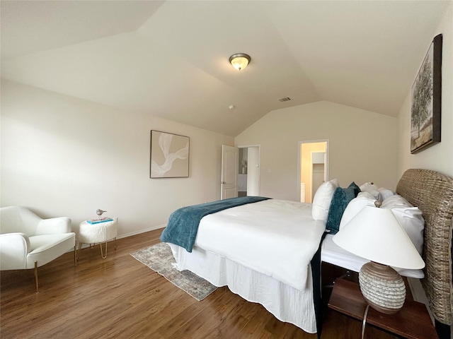 2041 Matador Ranch Rd, Fort Worth, TX 76134 - bedroom with lofted ceiling, wood finished floors, and baseboards