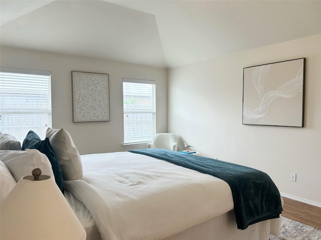2041 Matador Ranch Rd, Fort Worth, TX 76134 - bedroom featuring wood finished floors, baseboards, and vaulted ceiling