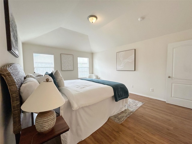 2041 Matador Ranch Rd, Fort Worth, TX 76134 - bedroom with wood finished floors, lofted ceiling, and baseboards