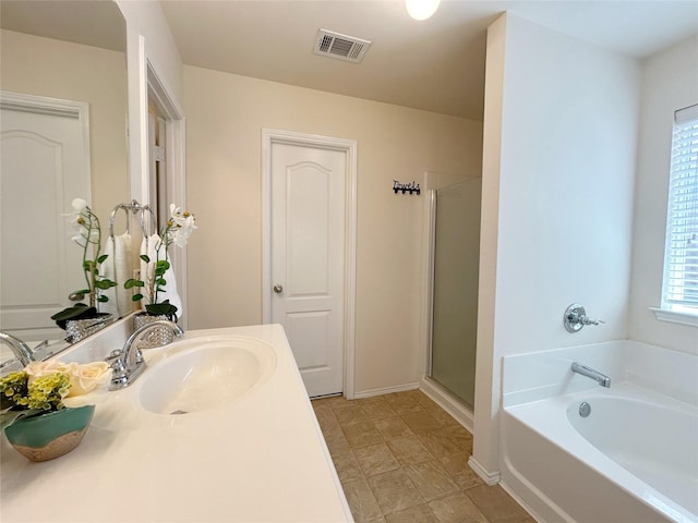 2041 Matador Ranch Rd, Fort Worth, TX 76134 - bathroom with a stall shower, a bath, vanity, and baseboards