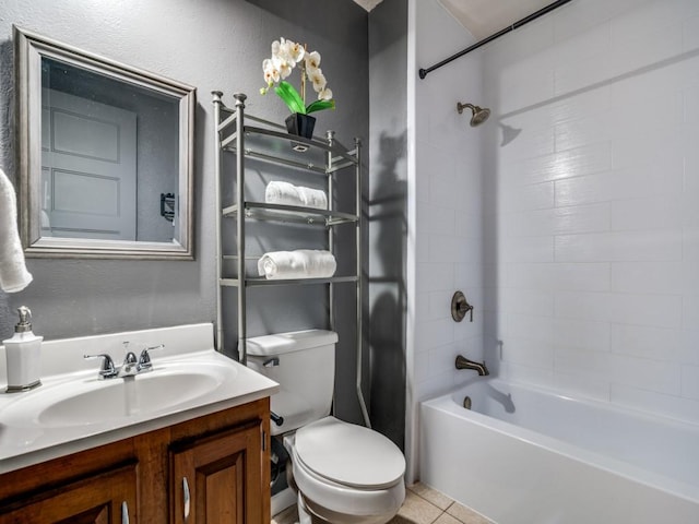 bathroom featuring toilet, shower / washtub combination, vanity, and tile patterned floors