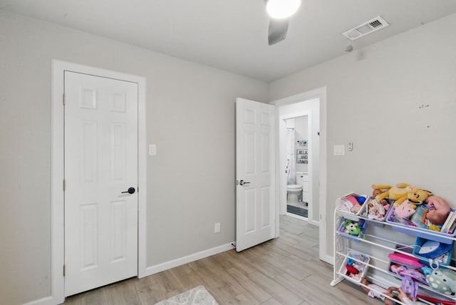 playroom featuring light wood-type flooring and baseboards