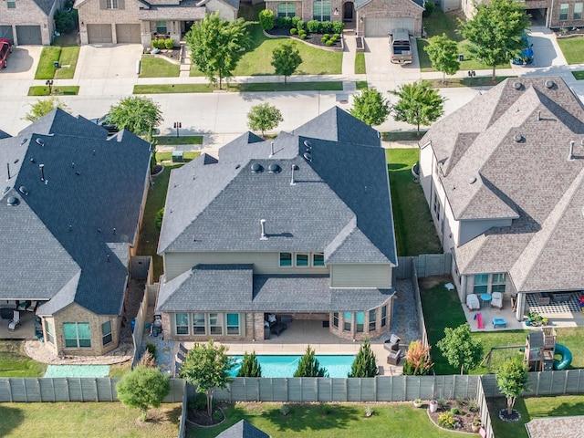 aerial view of residential area with a pool area