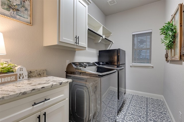 109 Highland Ranch Dr, Paradise, TX 76073 - washroom with washing machine and clothes dryer, cabinet space, and baseboards