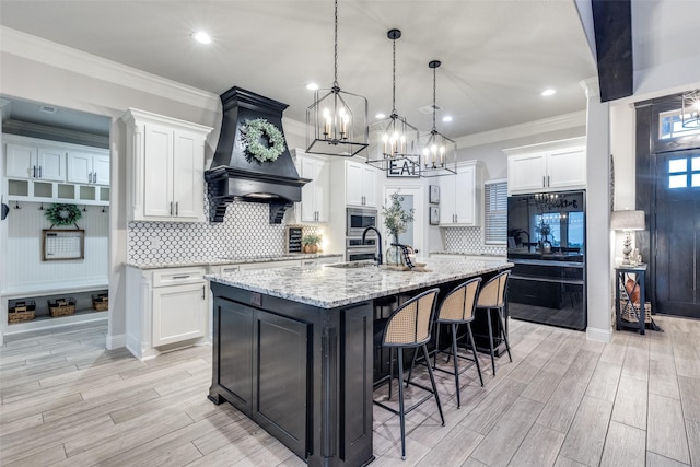 109 Highland Ranch Dr, Paradise, TX 76073 - kitchen featuring a chandelier, stainless steel microwave, white cabinetry, recessed lighting, and crown molding