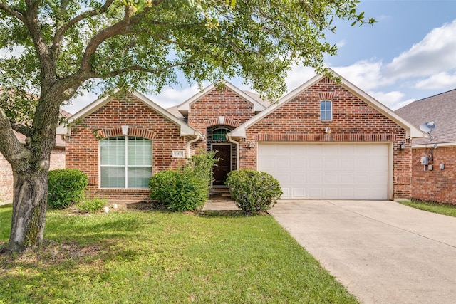 traditional-style home with brick siding, a garage, concrete driveway, and a front lawn