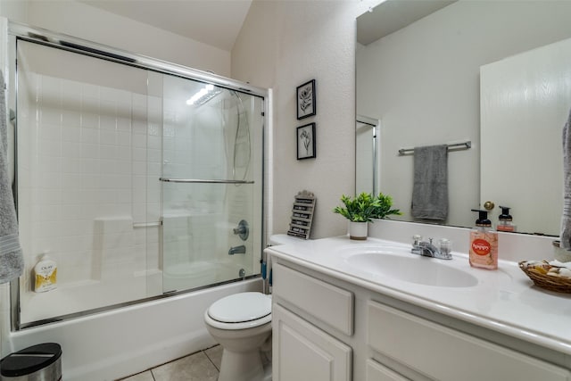 14117 Golden Pass Rd, Balch Springs, TX 75181 - full bath featuring vanity, toilet, bath / shower combo with glass door, and tile patterned floors