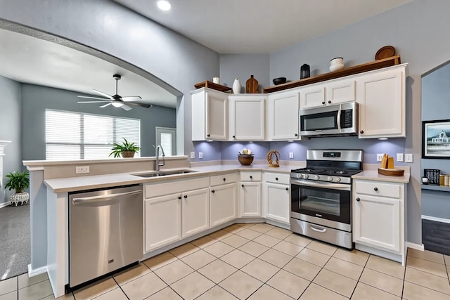 8505 Cactus Flower Dr, Fort Worth, TX 76131 - kitchen featuring stainless steel appliances, light countertops, ceiling fan, and white cabinets