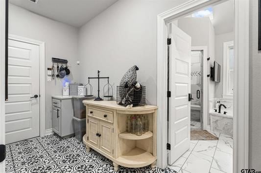 2230 Rana Park, Flint, TX 75762 - bathroom featuring a bath and marble look tile flooring