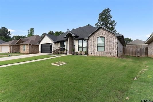 2230 Rana Park, Flint, TX 75762 - ranch-style house featuring brick siding, an attached garage, and driveway