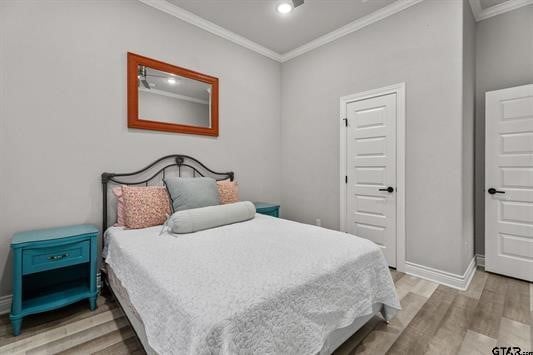2230 Rana Park, Flint, TX 75762 - bedroom with crown molding, light wood-type flooring, and baseboards