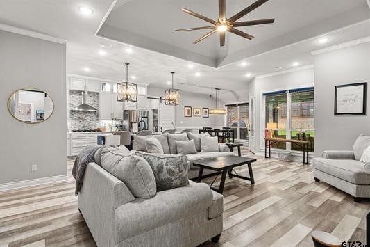 2230 Rana Park, Flint, TX 75762 - living area with a raised ceiling, a ceiling fan, recessed lighting, a chandelier, and light wood finished floors