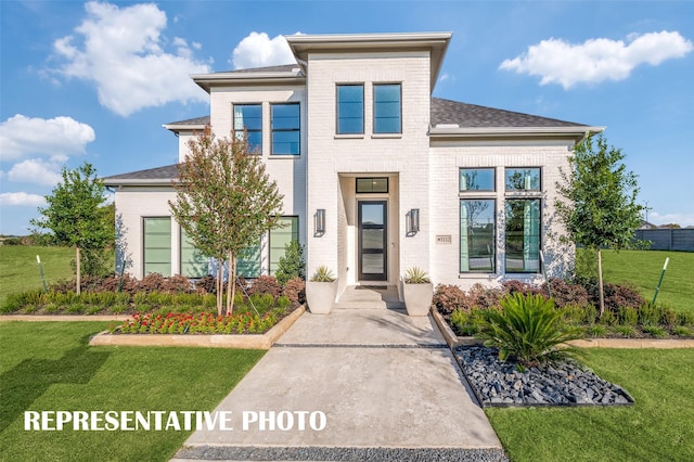 2316 Lakelet Dr, Mckinney, TX 75071 - view of front of house featuring a front lawn, roof with shingles, and brick siding