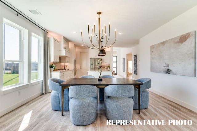 2316 Lakelet Dr, Mckinney, TX 75071 - dining room featuring a chandelier, light wood-style floors, baseboards, and recessed lighting
