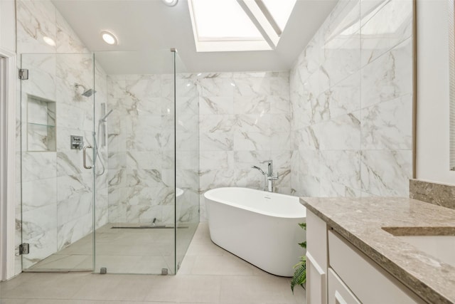 full bathroom with a marble finish shower, a soaking tub, vanity, tile walls, and recessed lighting