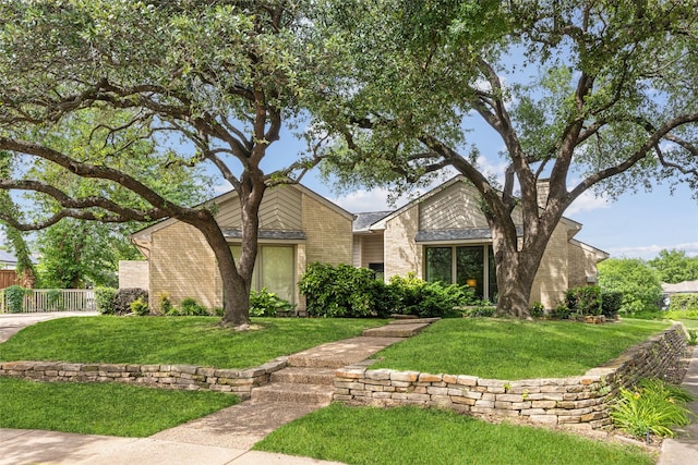 mid-century inspired home with brick siding