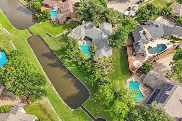 aerial perspective of suburban area featuring a pool area