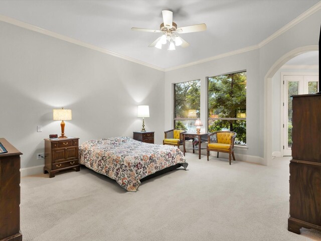 901 Saint James Dr, Fairview, TX 75069 - carpeted bedroom with multiple windows, arched walkways, baseboards, ornamental molding, and ceiling fan