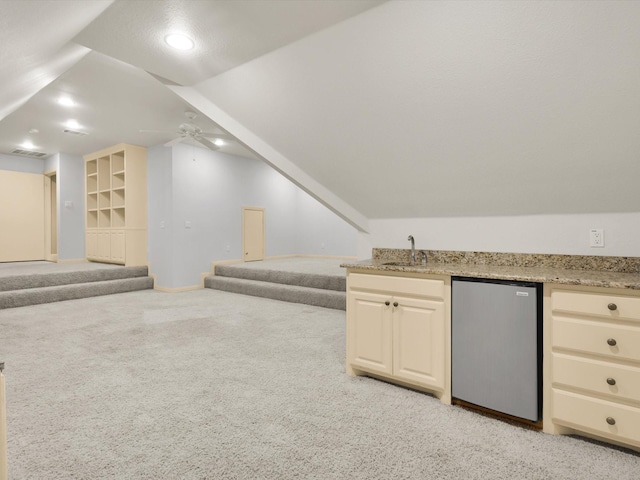 901 Saint James Dr, Fairview, TX 75069 - additional living space with light colored carpet, bar with sink, stairway, a ceiling fan, and baseboards