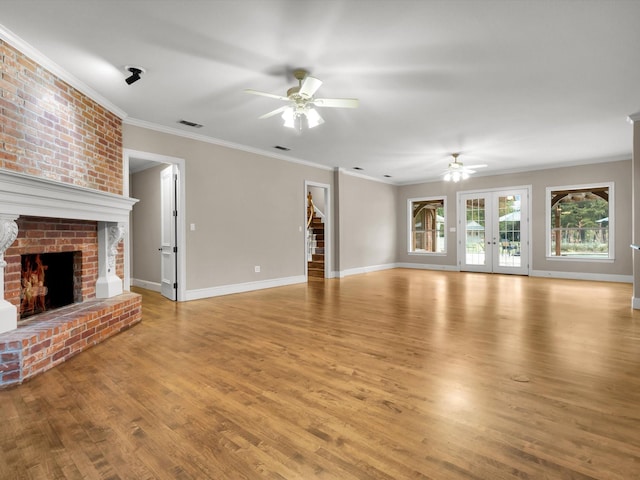 901 Saint James Dr, Fairview, TX 75069 - unfurnished living room featuring a ceiling fan, ornamental molding, light wood-type flooring, a brick fireplace, and baseboards
