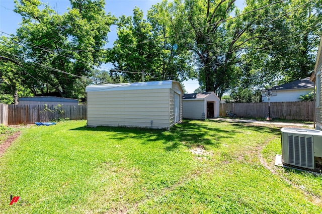 236 Leland Dr, Shreveport, LA 71105 - view of yard featuring cooling unit, a shed, and an outdoor structure