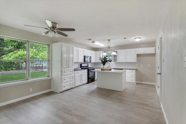 200 Herberta St, Pottsboro, TX 75076 - kitchen featuring black appliances, baseboards, backsplash, white cabinets, and ceiling fan