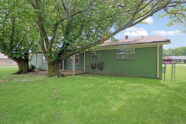 200 Herberta St, Pottsboro, TX 75076 - rear view of house featuring brick siding and a chimney