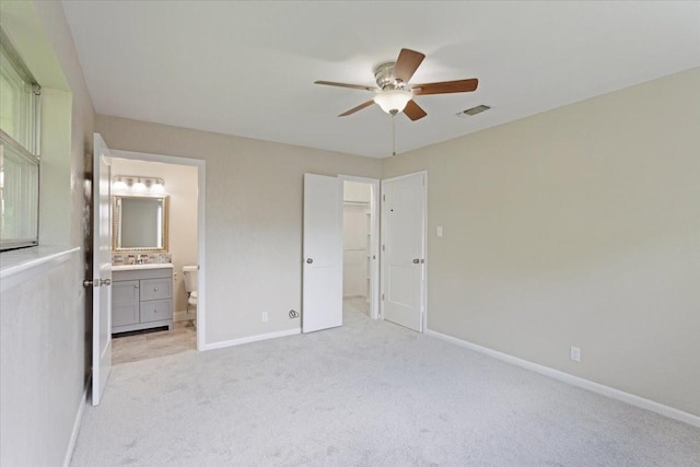 200 Herberta St, Pottsboro, TX 75076 - unfurnished bedroom featuring baseboards, light colored carpet, ensuite bathroom, ceiling fan, and a sink