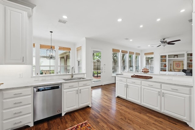 4919 Purdue Ave, Dallas, TX 75209 - kitchen with dishwasher, a sink, dark wood-style flooring, white cabinets, and a peninsula