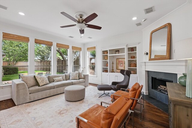 4919 Purdue Ave, Dallas, TX 75209 - living area with a ceiling fan, ornamental molding, wood finished floors, a fireplace, and recessed lighting