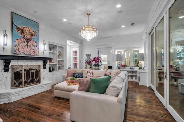 417 Windwood Ct, Mckinney, TX 75071 - living area featuring hardwood / wood-style floors, crown molding, a stone fireplace, recessed lighting, and a chandelier