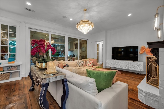417 Windwood Ct, Mckinney, TX 75071 - living room with a chandelier, wood finished floors, crown molding, and recessed lighting